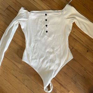 NWOT white off the shoulder Henley bodysuit with dark brown button details.